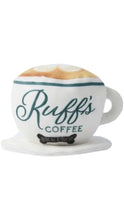 Load image into Gallery viewer, Novelty plush dog toy shaped like a white coffee cup and saucer, featuring “Ruff’s Coffee” lettering in dark green and a tan foam detail on top.