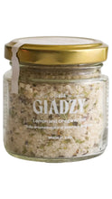 Load image into Gallery viewer, A glass jar of GIADZY Lemon and Oregano Salt with a gold metal lid, shown against a plain white background.