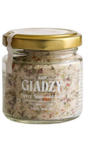 Load image into Gallery viewer, A glass jar of Giadzy Spicy Seasoned Salt with a gold metal lid, shown against a plain white background.
