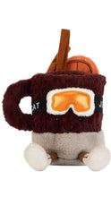 Load image into Gallery viewer, A plush novelty toy shaped like a hot cocoa mug with a face, wearing orange ski goggles and holding a brown handle, set against a plain white background.