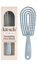 Load image into Gallery viewer, Detangling flexi brush with packaging on a white background