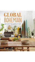 Load image into Gallery viewer, Book cover for 'Global Bohemian: How to Satisfy Your Wanderlust at Home' by Fifi O'Neill, featuring a styled bohemian living room scene with surfboards, plants, woven baskets, and a wooden dining table.