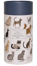 Load image into Gallery viewer, A cylindrical product box for a cat-themed jigsaw puzzle, featuring an illustrated pattern of various cat breeds on a white background with a dark navy lid.