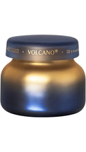 Load image into Gallery viewer, Capri Blue Artisan Volcano 8 oz candle in a rounded glass jar with a rich navy-to-gold ombré finish and coordinating navy lid with gold lettering.