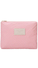 Load image into Gallery viewer, Pink checkered pouch with a brand label on a white background