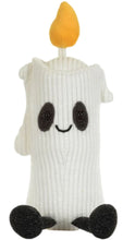 Load image into Gallery viewer, A white ribbed knit candle-shaped plush toy with a yellow flame on top, black embroidered eyes and smile, and black feet, shown on a plain white background.