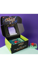 Load image into Gallery viewer, A retro arcade game kit shown open in its branded box, with a small joystick controller placed beside it on a pale surface against a purple background. The box reads 'Galaga'.