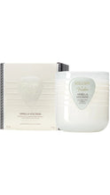 Load image into Gallery viewer, Voluspa x Fender Vanilla Voltage 11 oz coconut wax candle in a glossy white ribbed glass jar with a pale mint guitar pick-shaped label, displayed beside its matching cream-colored box with black trim.