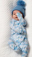 Load image into Gallery viewer, A newborn baby with a blue pom hat wearing a blue onesie with a mountain ski town design.