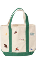 Load image into Gallery viewer, An off-white canvas tote bag with green handles and bottom trim, decorated with small embroidered Colorado-themed motifs including a bear, football, mountain, and the text 'COLORADO' and 'ROCKIES'.