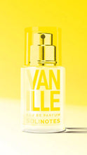 Load image into Gallery viewer, A bottle of Solinotes Eau de Parfum with a yellow label and cap, on a yellow background.