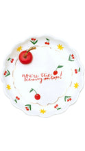 Load image into Gallery viewer, A white scalloped ceramic plate with a cherry-themed design. The center features the phrase 'You're the cherry on top!' in red script, surrounded by illustrations of red cherries, green leaves, yellow stars, and a gold inner border.