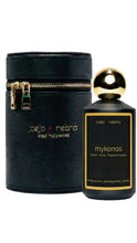 Load image into Gallery viewer, A bottle of Jojo Nebria West Hollywood Mykonos home and body fragrance spray next to its black textured cylindrical carrying case with gold zipper and gold lettering, on a white background.