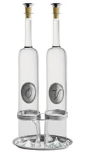 Load image into Gallery viewer, Two clear glass bottles with cork stoppers and silver-toned metal bands, displayed side by side on a matching silver tray against a white background.