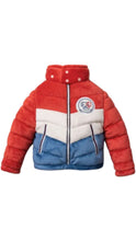 Load image into Gallery viewer, Plush dog toy shaped like a puffer jacket with a red, white, and blue color-block design, zippered front, side pocket details, and a Mutts &amp; Co. patch on the chest.
