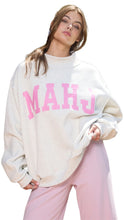 Load image into Gallery viewer, Oversized cream sweatshirt with a high mock neckline and bold pink “MAHJ” lettering across the front, styled with soft pink pants.
