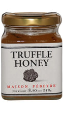 Load image into Gallery viewer, Maison Pébeyre Truffle Honey in a clear glass jar with a gold lid, white label, and black truffle illustration.
