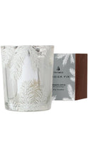 Load image into Gallery viewer, Thymes Frasier Fir aromatic votive candle in a clear glass vessel etched with delicate white fir branches, shown beside its coordinating gray and woodgrain-inspired box.
