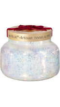 Load image into Gallery viewer, Capri Blue Artisan Tinsel &amp; Spice candle in an iridescent white glass jar with a brushed gold lid, finished with a festive deep red velvet bow.
