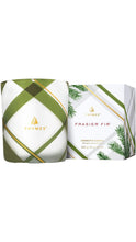 Load image into Gallery viewer, Thymes Frasier Fir aromatic candle in a white vessel featuring an olive green, gray, and gold plaid design, displayed beside coordinating packaging with fir branch illustrations.
