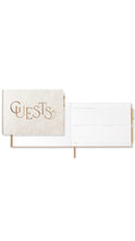 Load image into Gallery viewer, A white guest book with a textured cream cover featuring the word 'GUESTS' in elegant gold script, against a plain white background.
