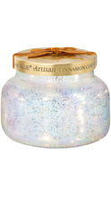 Load image into Gallery viewer, Capri Blue Artisan Cinnamon Cortado candle in an iridescent white glass jar with a brushed gold lid, finished with a warm caramel velvet bow.
