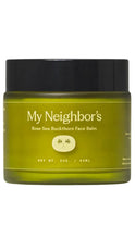 Load image into Gallery viewer, Green glass jar of My Neighbor’s Rose Sea Buckthorn Face Balm with a glossy black lid, cream-colored lettering, and a small rose illustration. The 2 oz face balm is shown against a clean white background.
