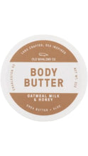 Load image into Gallery viewer, Old Whaling Co. Oatmeal Milk &amp; Honey body butter in a round white 2 oz. container with a tan and white label.
