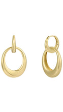 Load image into Gallery viewer, A pair of polished yellow gold hoop earrings with a thick, rounded organic oval design and a small top loop, shown on a plain white background.
