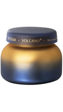 Load image into Gallery viewer, Capri Blue Artisan Volcano candle in a rounded glass jar with a dramatic navy-to-gold ombré finish and coordinating navy lid with gold lettering.

