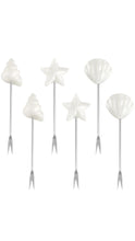 Load image into Gallery viewer, Six white seashell and starfish-shaped serving forks with silver metal handles, arranged on a plain white background.
