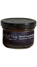 Load image into Gallery viewer, A glass jar of Eat This Yum! Cabernet Caramelized Onion, featuring a dark label and a black lid, set against a plain white background.

