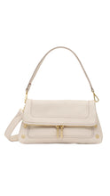 Load image into Gallery viewer, Beige handbag with gold accents on a white background
