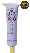 Load image into Gallery viewer, Hand balm tube with floral design and gold cap on white background
