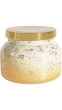 Load image into Gallery viewer, Capri Blue candle in a rounded glass jar with a frosted white-to-gold ombré finish, distressed metallic gold detailing, and a polished gold lid.
