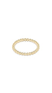 Gold beaded ring on a white background