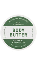 Load image into Gallery viewer, A round white container lid for Old Whaling Co. Body Butter in Spearmint &amp; Eucalyptus, featuring a dark green circular label with white text.
