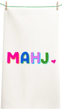 Load image into Gallery viewer, White towel with colorful 'MAHJ' text and a heart on a white background
