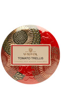 Load image into Gallery viewer, A round tin of Voluspa Tomato Trellis coconut wax bougie perfume, featuring a red and gold patterned lid with a central cream-colored label.

