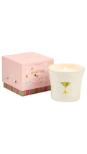 Load image into Gallery viewer, A pink square gift box with cocktail-themed illustrations sits beside a white candle in a glass holder featuring a green martini glass graphic. The candle is lit, and the box is labeled 'MARTINI'.
