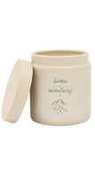 Cream ceramic candle jar with matching lid, featuring a green mountain illustration and the phrase “Home is where the mountains are,” against a white background.