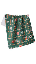 Load image into Gallery viewer, A kitchen towel featuring a retro-style mahjong tile pattern on a dark green background. The pattern includes orange borders, white and pink flowers
