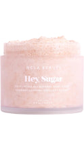 Load image into Gallery viewer, NCLA Beauty Hey, Sugar Exfoliating All Natural Body Scrub in a pale pink 8.8 oz jar, shown open to reveal the textured sugar scrub inside.
