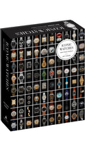 Load image into Gallery viewer, Iconic Watches 500-piece puzzle by Matt Hranek, featuring a black box decorated with a grid of colorful vintage and contemporary wristwatches, a circular white title label, and Artisan branding.
