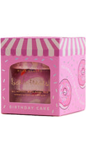 Load image into Gallery viewer, Pink NCLA Beauty bath treats gift box with a pink and white striped awning design, donut graphics, and a clear window showing the bath bombs inside, labeled Birthday Cake.
