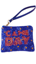Load image into Gallery viewer, A blue beaded wristlet clutch with 'GAME DAY' written in orange sequins, decorated with small orange and white star accents, and featuring a matching blue wrist strap with gold-tone hardware.
