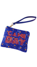 Load image into Gallery viewer, A blue beaded wristlet clutch with 'GAME DAY' written in orange sequins, decorated with small orange and white star accents, and featuring a matching blue wrist strap with gold-tone hardware.
