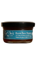 Load image into Gallery viewer, A glass jar of Eat This Yum! Uncured Bacon Marmalade with a black lid and a blue label, shown against a plain white background.
