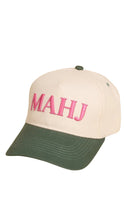 Load image into Gallery viewer, Beige and green cap with 'MAHJ' in pink on a white background
