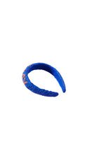 Load image into Gallery viewer, A beaded royal blue headband with orange embroidered lettering on the side, displayed against a solid white background.
